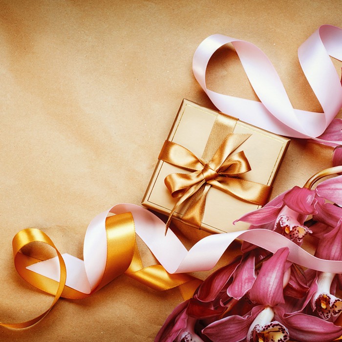 Gold-coloured gift box with flowers