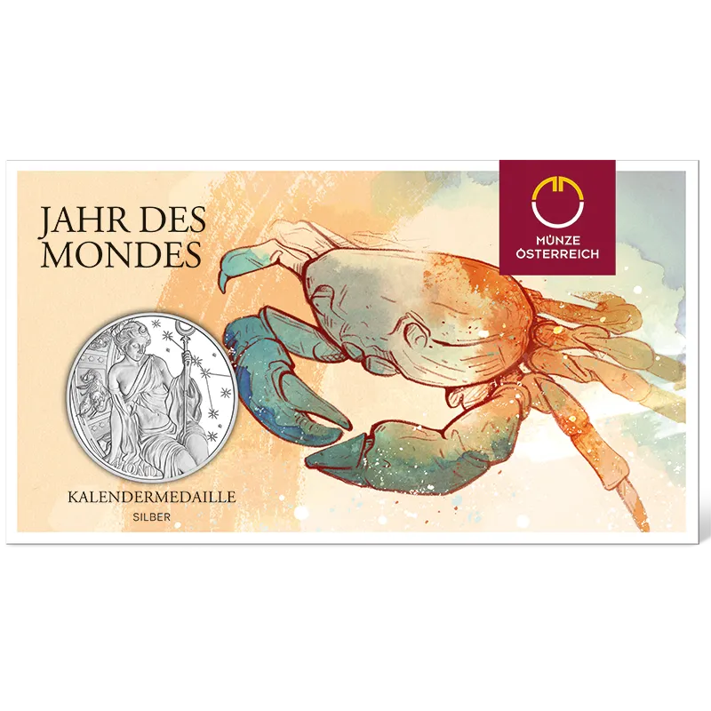 Kalendermedaille 2027 in Silber Avers zeigt eine Frau mit Mondsichel im Haar, die einen Stab hält, neben einem Krebs-Symbol und Sternen und Schriftzug 'Mond' im farbigen Blister mit Krebszeichnung verpackt und Schriftzug 'Jahr des Mondes'